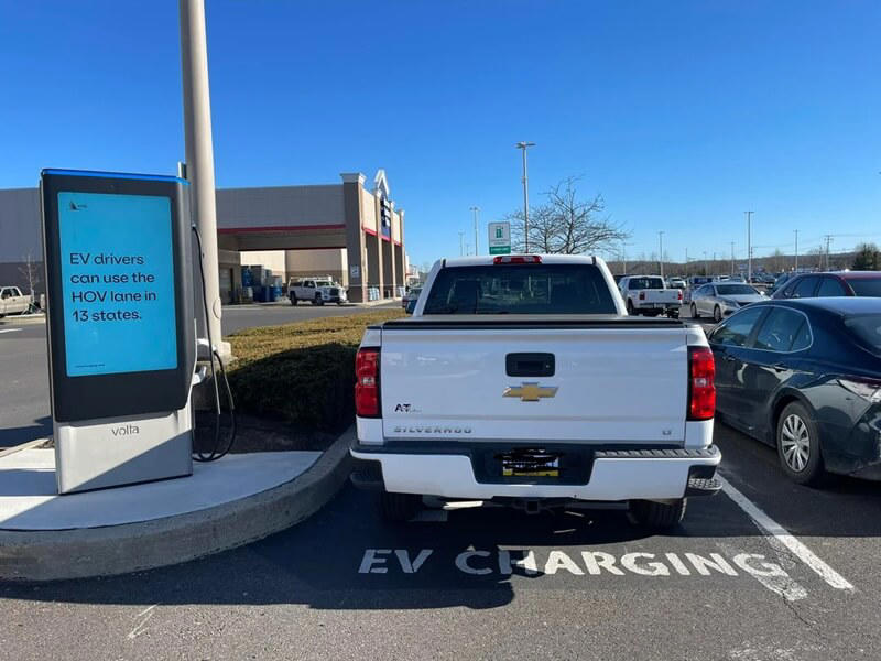 driver shares frustration with photo of 'gas guzzler' parked in electric charging spot: 'why is it that pickup truck drivers have such hate for evs?'