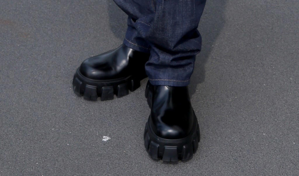 nct's jaehyun goes grunge in monolith lug-sole boots at prada's summer 2025 show during milan fashion week