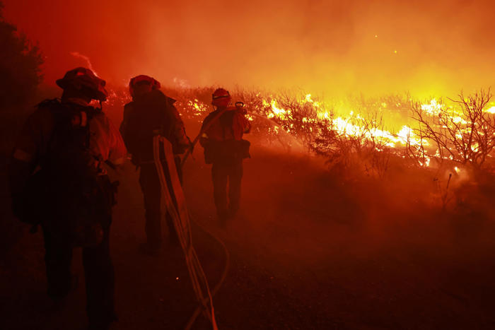 wildfire near los angeles spreads to 12k acres, forcing evacuations