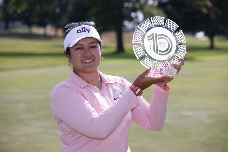 Lilia Vu holds the trophy after winning the Meijer LPGA Classic golf tournament, Sunday, June 16, 2024, in Belmont, Mich. (AP Photo/Al Goldis)