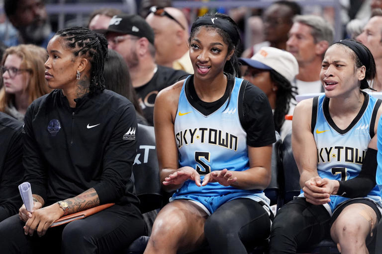 INDIANAPOLIS, INDIANA - JUNE 16: Angel Reese #5 of the Chicago Sky reacts to a basket from the bench during the second half against the Indiana Fever at Gainbridge Fieldhouse on June 16, 2024 in Indianapolis, Indiana. Emilee Chinn/Getty Images