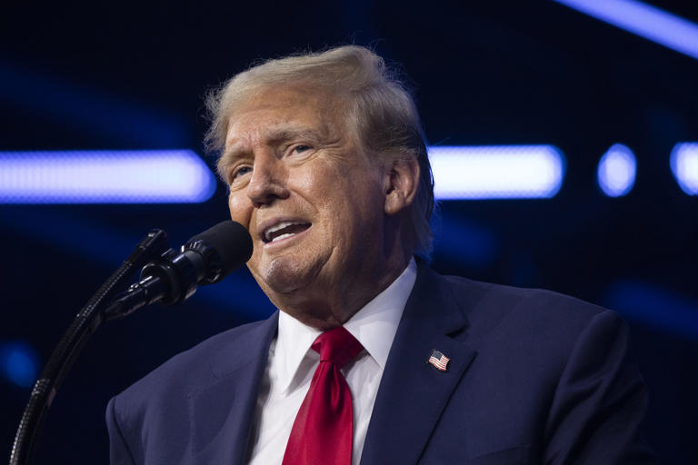 Former President Donald Trump gives the keynote address at Turning Point Action's "The People's Convention" on June 15, 2024 in Detroit, Michigan. Video of Trump walking down the stairs of a plane has made its way across social media on Saturday, sparking mockery from critics.