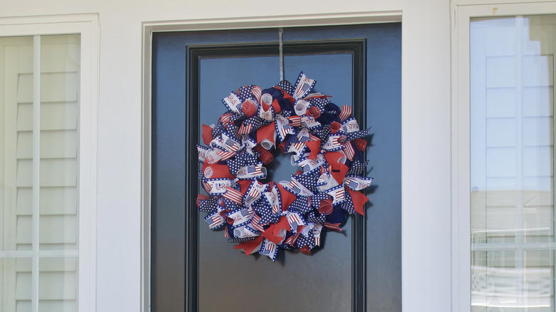 use a pool noodle to diy a festive patriotic wreath for your front porch