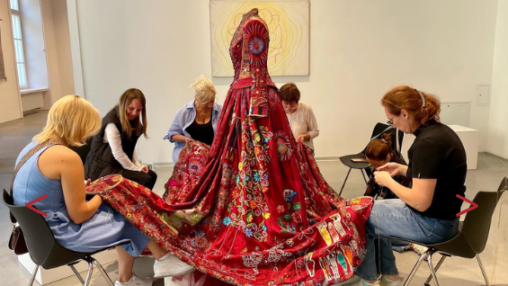global red dress embroidery project returns to somerset