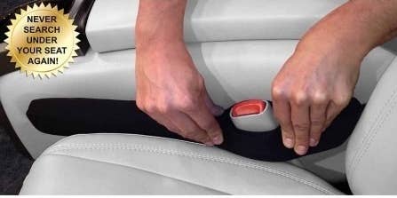 seat gap filler with hole for seatbelt buckle to fit through