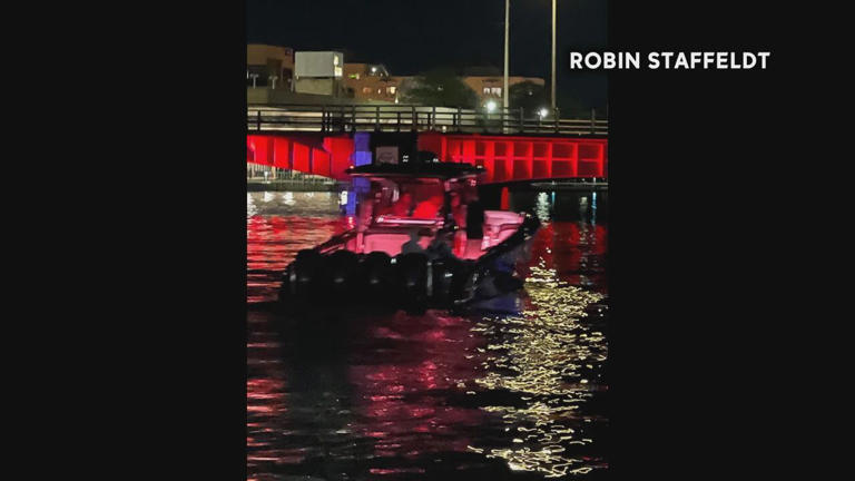A powerboat leaves the scene after striking an On the Loos pleasure cruise on the Fox River on July 9, 2022. Witnesses said the driver turned off the boat's light as they fled.