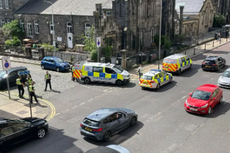 Police rush to busy Edinburgh street as it 'kicks off' close to funeral ...