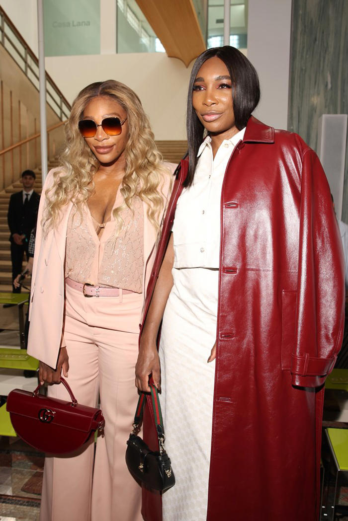 venus and serena williams model trending maroon and blush tones alongside mother and half sister at gucci menswear spring 2025 show in milan
