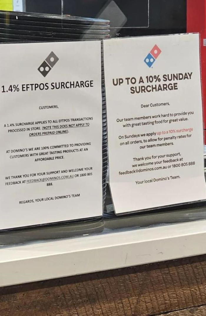 signs in domino’s store spark outrage