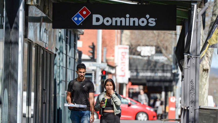 signs in domino’s store spark outrage