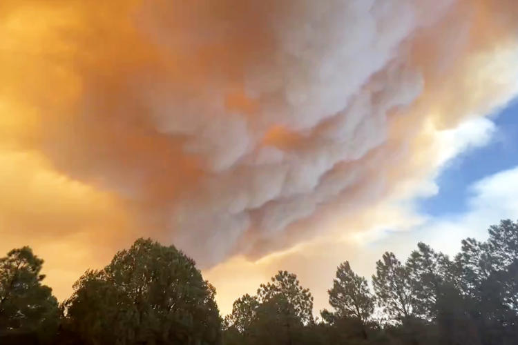 Evacuations ordered in New Mexico village after fast-moving wildfire grows rapidly