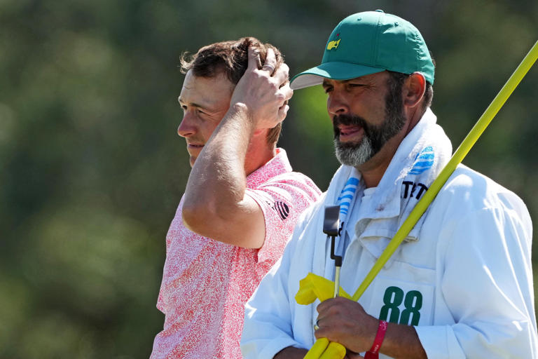 Jordan Spieth reacts with caddie Michael Greller on the 18th green during the second round of the 2024 Masters Tournament at Augusta National Golf Club. (Photo: Kyle Terada-USA TODAY Network)
