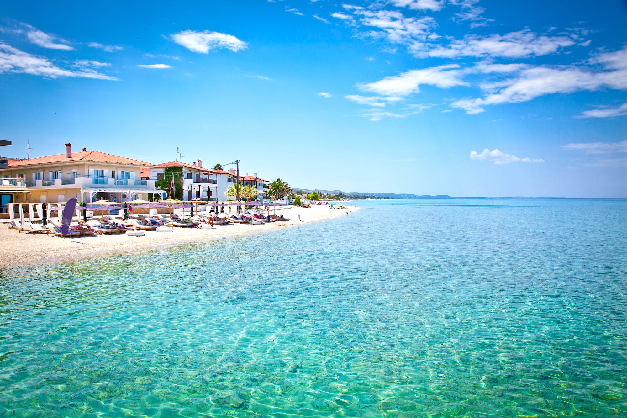 <p>Sure, Santorini's got those gorgeous white buildings, and Mykonos has the wild nightlife. But if you're looking for an incredible beach vacation, you might be better off on the mainland. </p><p>Even as a kid, I remember being stunned by the beaches in Halkidiki. The sand is soft and white, the water is warm, and the colors of the sea are the brightest blues you'll ever see. One summer my mom and uncle took me to a different beach every day, and she still loves to tell the story of how I gave all the Halkidiki beaches an "A++" because I loved them so much. </p><p>Halkidiki is near Thessaloniki, so it's also a great place to visit if you want to combine a city escape with a beach destination. Plus, with so many local tavernas by the sea, you're sure to have a great meal of octopus, ouzo on the rocks, and some calamari. </p><p>"If all you want for your vacation is to lie on a beach and listen to the waves, Halkidiki is your destination," my mom said. </p>