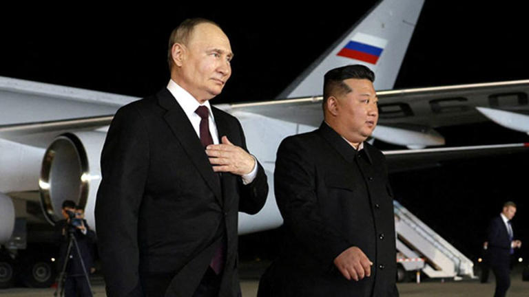 Russia's President Vladimir Putin is greeted by North Korea's leader Kim Jong Un during a welcoming ceremony at an airport in Pyongyang on June 19, 2024. - Gavriil Grigorov/Sputnik/Reuters