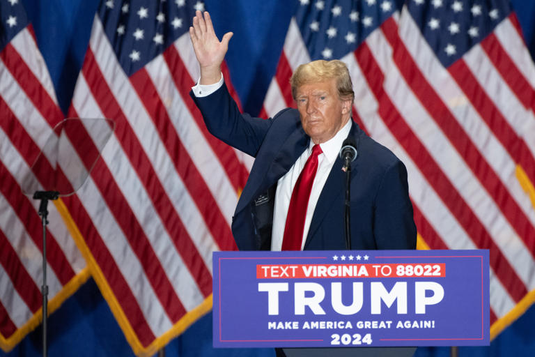 Former US President and 2024 presidential hopeful Donald Trump waves during a "Get Out the Vote" rally at the Greater Richmond Convention Center in Richmond, Virginia, on March 2, 2024. The Trump-endorsed candidate, Sen. John McGuire, is currently beating rep. Bob Good in the GOP primary for Virginia’s 5th Congressional District by just 327 votes.