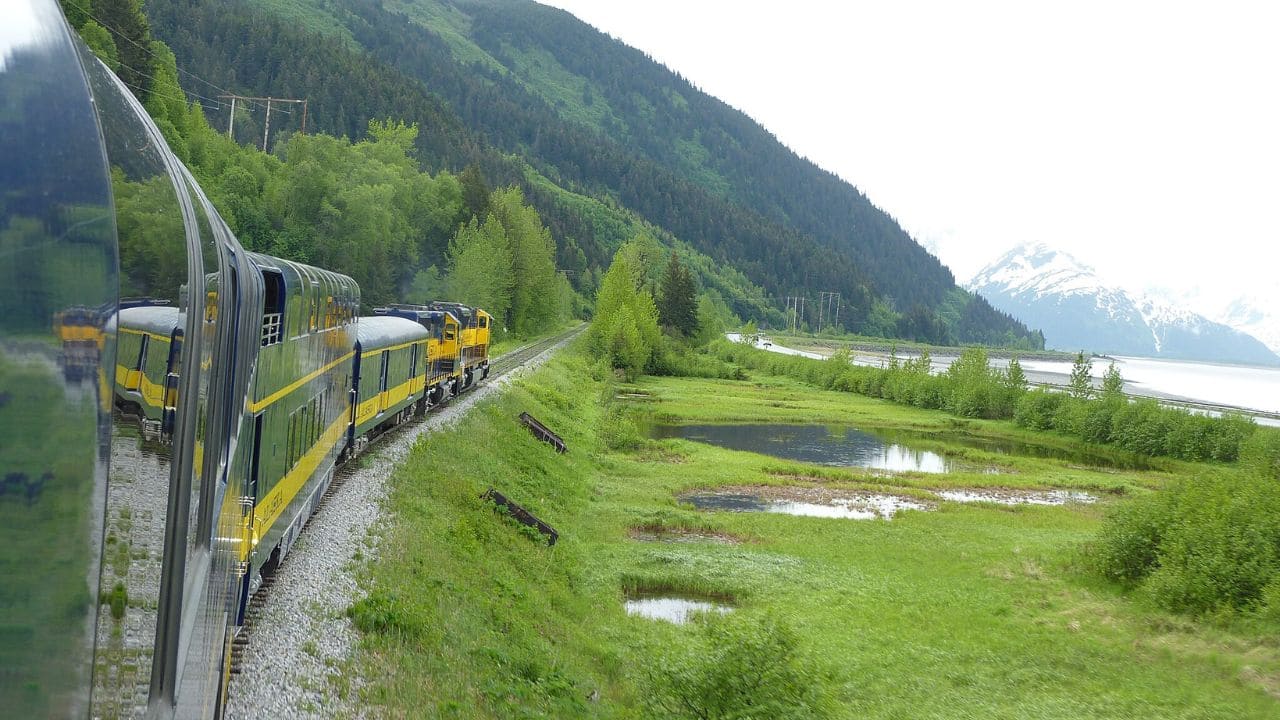 <p>There’s something otherworldly about Alaska, and this <a href="https://www.alaskarailroad.com/ride-a-train/our-trains/coastal-classic">train journey</a> allows you to experience a taste of this breathtaking landscape. The Alaska Coastal Classic leaves in the morning and will take you along Turnagain Arm to view the Chugach Range. Just before lunchtime, you’ll reach the town of Seward.</p><p>This coastal town looks out over aqua-colored waters with a backdrop of snow-capped mountains. You’ll also find quaint shops, restaurants, and the Alaska SeaLife Center.</p>