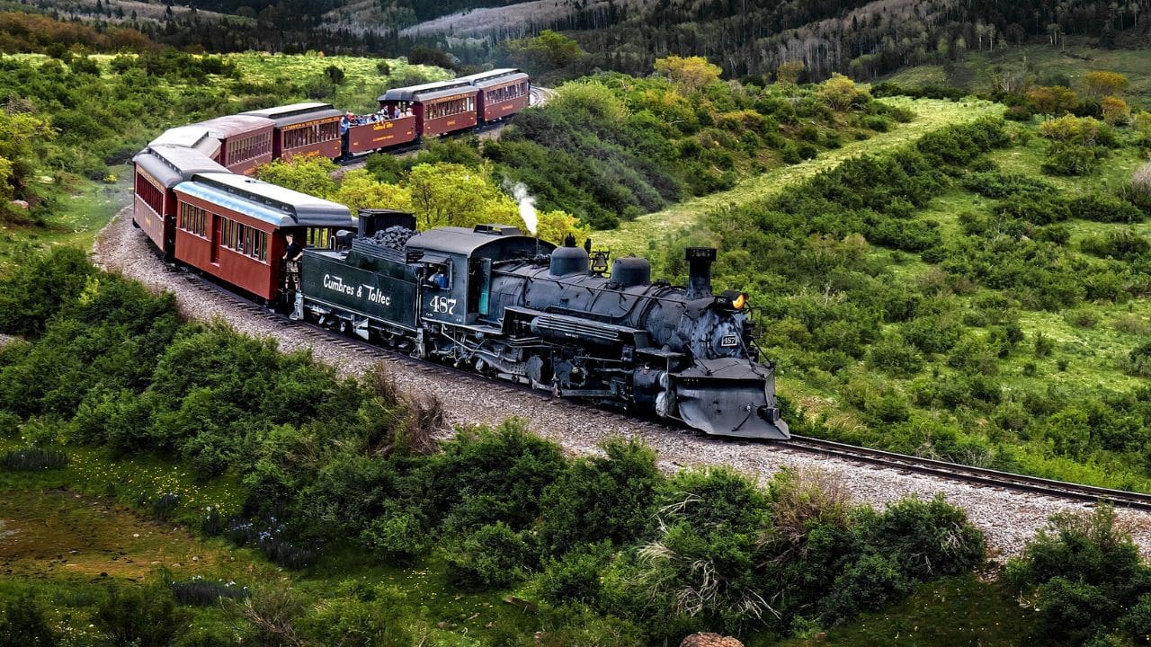 <p>This historic steam train takes you on a 64-mile <a href="https://cumbrestoltec.com/" rel="noopener">journey</a> through the stunning Rocky Mountain West. It winds from Colorado to New Mexico, passing plains of wildflowers, ancient forests, and a rocky gorge. </p><p>You’ll hear the steam engine whistle echoing along canyon walls, and perhaps you’ll hold your breath as your train car chugs over the 137-foot Cascade Trestle bridge. Keep an eye out for some woodland creatures along the way. </p>