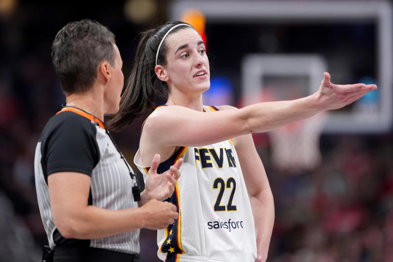 INDIANAPOLIS, INDIANA - JUNE 19: Caitlin Clark #22 of the Indiana Fever argues a call with a referee during the second half of a game against the Washington Mystics at Gainbridge Fieldhouse on June 19, 2024 in Indianapolis, Indiana. Emilee Chinn/Getty Images