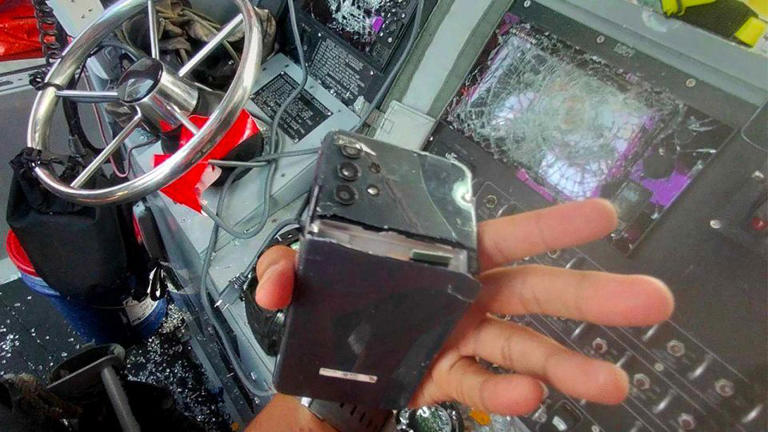 This handout photograph released by the Philippine military shows destroyed communication and navigational equipments including a cellphone on a Philippine navy boat. - Armed Forces of the Philippines/AFP/Getty Images