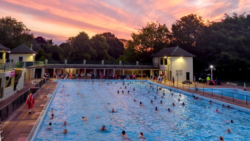 swimmers take in glorious summer solstice sunrise