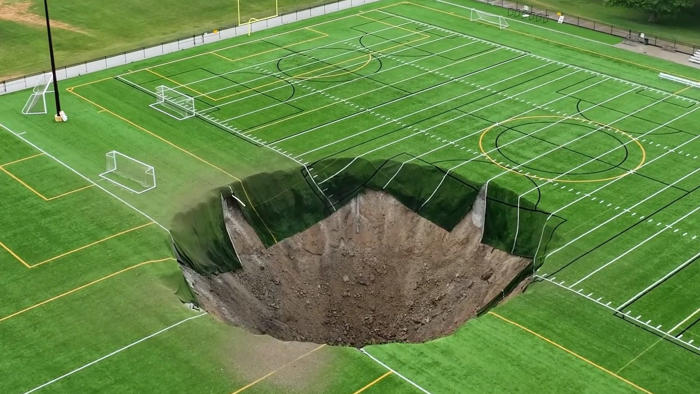video shows giant sinkhole at illinois soccer field following mine collapse: watch