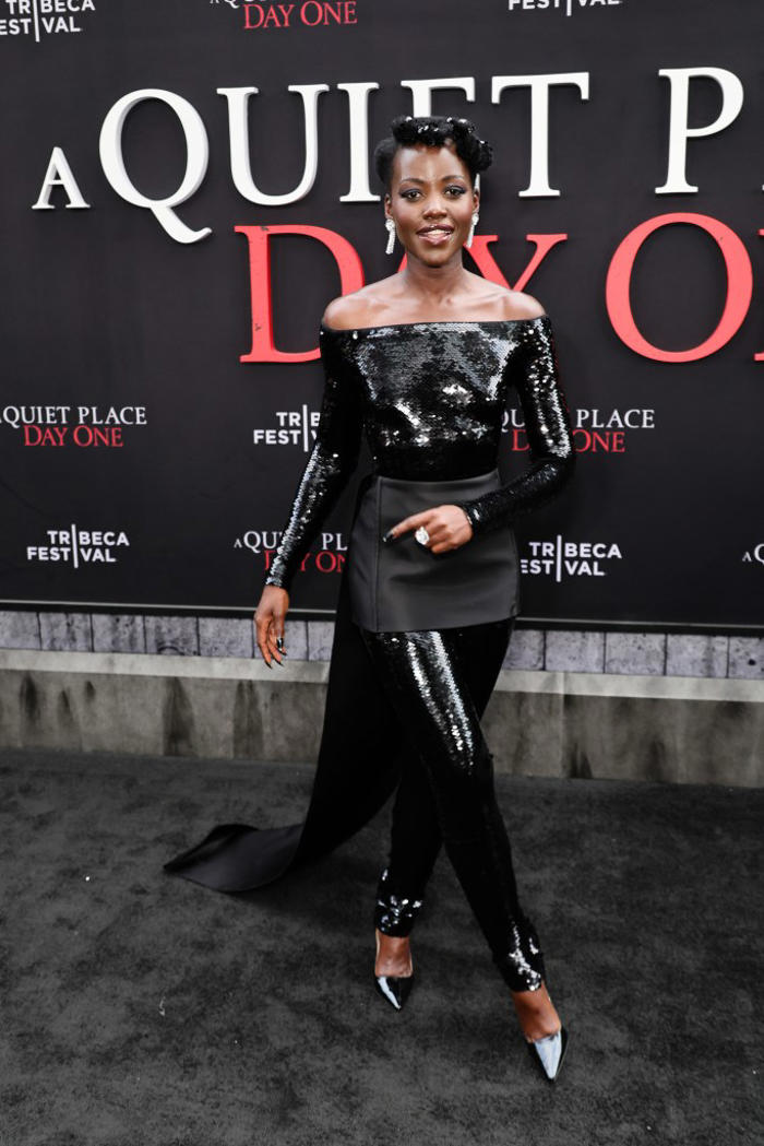 lupita nyong'o glitters in custom prada jumpsuit and pointed pumps at ‘a quiet place: day one' premiere in new york city