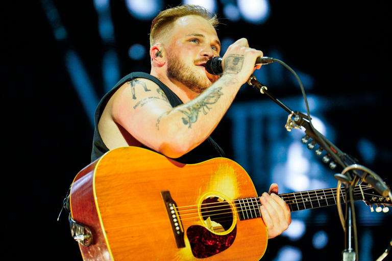 Zach Bryan performs during his concert at Gillette Stadium Wednesday night.