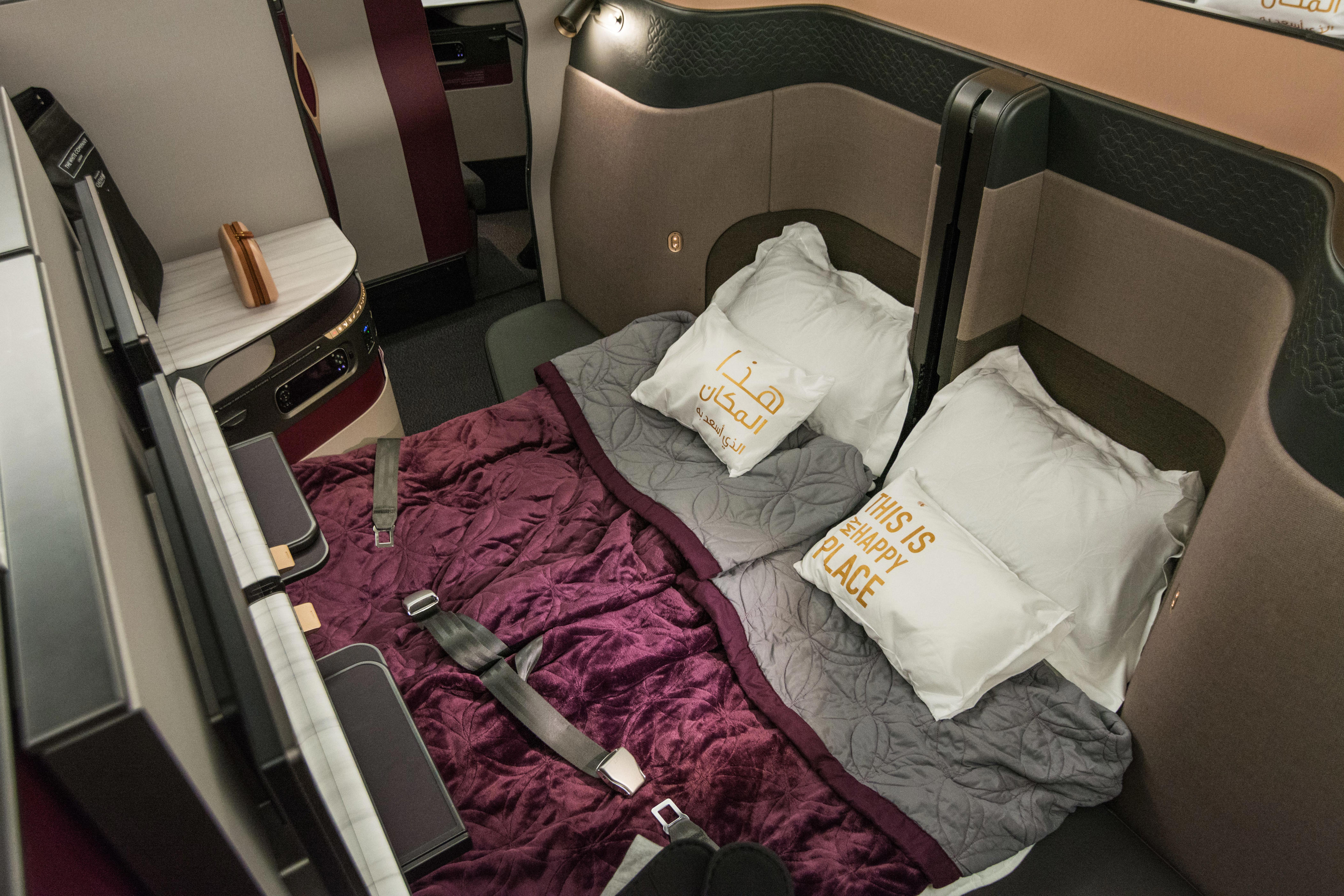<p>Qatar revolutionized business class with sliding doors and its convertable lie-flat beds that combine two into one.</p><p>The QSuite cabin also offers quad seating, so four people can dine or meet.</p>