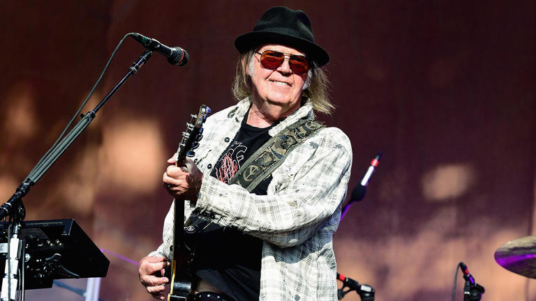 Neil Young and Crazy Horse are taking an "unplanned" tour break due to illness among band members. Getty Images