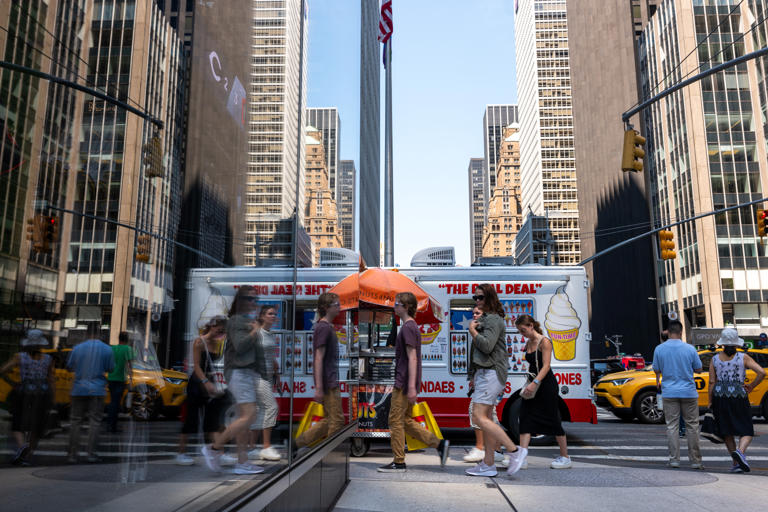 People walk through midtown Manhattan as much of the Northeast brace for a heat wave on June 18, 2024 in New York City. Gen Z-ers were more likely to prioritize travel over children if they were wealthier in a new report.