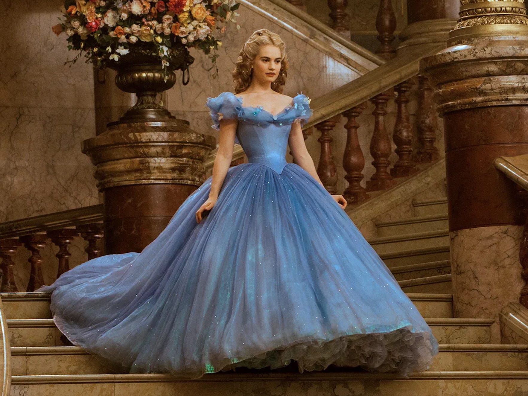 <p>Maybe this is because we just don't think the original "<a href="https://www.businessinsider.com/actors-who-played-cinderella-movies-tv-2021-10">Cinderella</a>" from 1950 is that good. Yes, "Bibbidi-Bobbidi Boo" is a banger, and the animation of Cinderella's dress turning from a ripped-up rag to a shimmering princess-worthy ball gown is beautiful, but that's really it.</p><p>The prince is barely a character, the other songs aren't that memorable, and Cinderella herself has little personality besides being sweet.</p><p>The 2015 "Cinderella" rectifies all that. Ella, as played by Lily James, is kind, funny, and has a very strong sense of right and wrong, while Prince Kit, played by a very blue-eyed Richard Madden, gets an arc and a loving relationship with his dad.</p><p>The famous blue ball gown is also one of the rare pieces of Disney iconography that looks just as beautiful in real life. We must also mention Cate Blanchett as a fully committed Lady Tremaine and Helena Bonham Carter as the dotty Fairy Godmother.</p><p>We'd go as far as to say that "Cinderella," at least for now, is the only true Disney remake worth your time.</p>