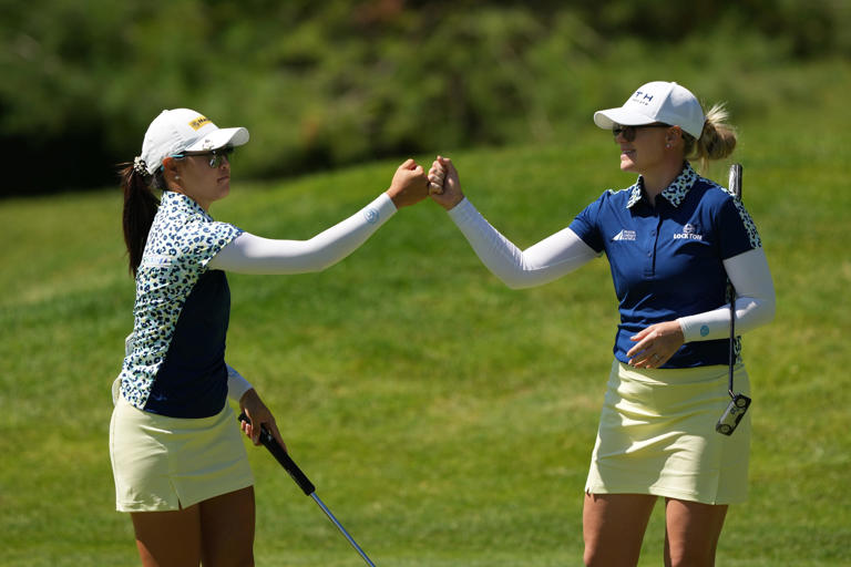 MIDLAND, MICHIGAN - JUNE 27: (L-R) Kelly Tan of Malaysia and Matilda Castren of Finland react after a birdie on the fifth green during the first round of the Dow Championship at Midland Country Club on June 27, 2024 in Midland, Michigan. (Photo by Dylan Buell/Getty Images)