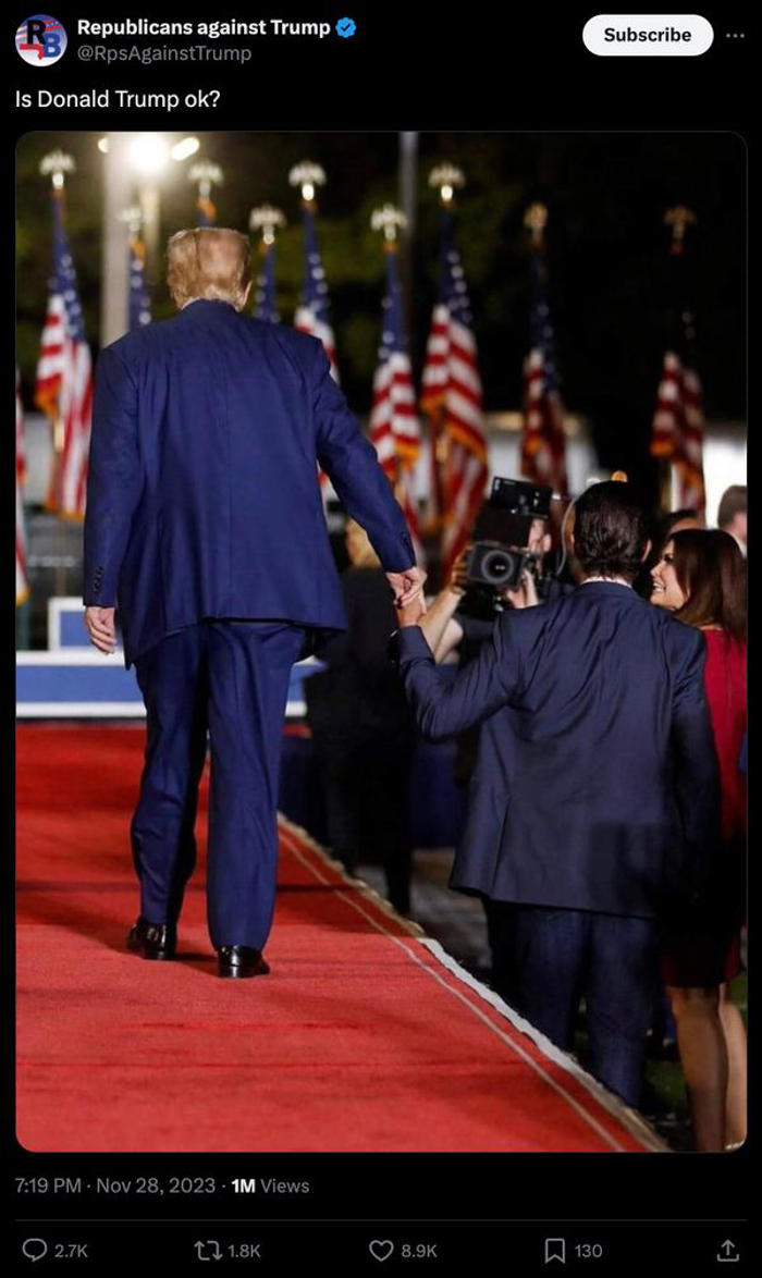fact check: photo allegedly shows trump holding son's hand because he needed help leaving stage. here's the truth