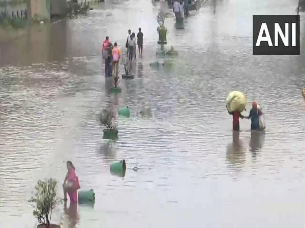 delhi rain: traffic crawls, people wade through waterlogged areas; bjp councillor rows in protest
