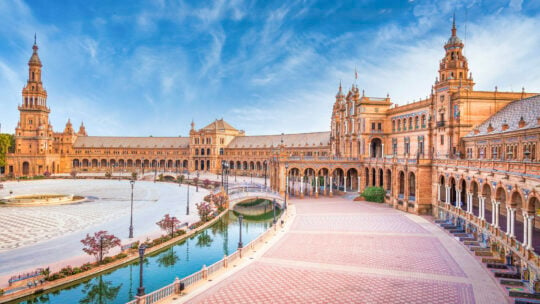 <p>Seville, southern Spain’s hottest city, is perfect for solo travel. Known for flamenco and the opera Carmen, it boasts historic sites like the Real Alcazar, where Columbus secured his voyage funds and the sailor-recruiting district of Triana. Rich in architectural charm, highlights include the Torre del Oro, the white-walled Santa Cruz quarter, and La Giralda Tower. Seville’s compact city center is ideal for solo explorers. Enjoy stunning architecture, tapas, and a friendly atmosphere where chatting in cafes and bars or relaxing with a book is the norm.</p>