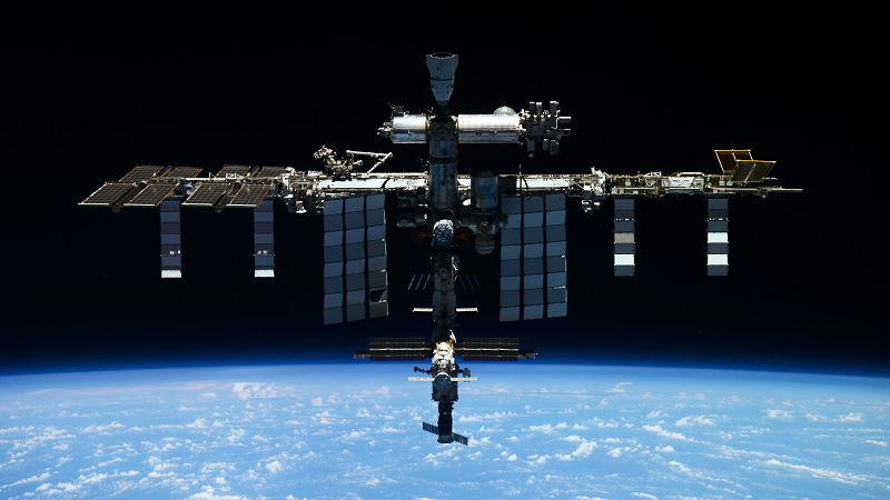 defunct russian satellite breaks apart forcing iss astronauts to react
