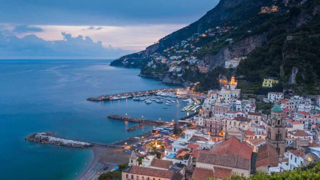 <p>The city of Amalfi is not far from Naples. It’s on the Amalfi Coast, which is famous for its historic buildings and the stunning Amalfi Cathedral.</p><p>When you visit the city, you will love its tiny streets and the incredible Duomo di Milano. This lovely place is sandwiched between mountains and water, making its beauty one of a kind. </p>