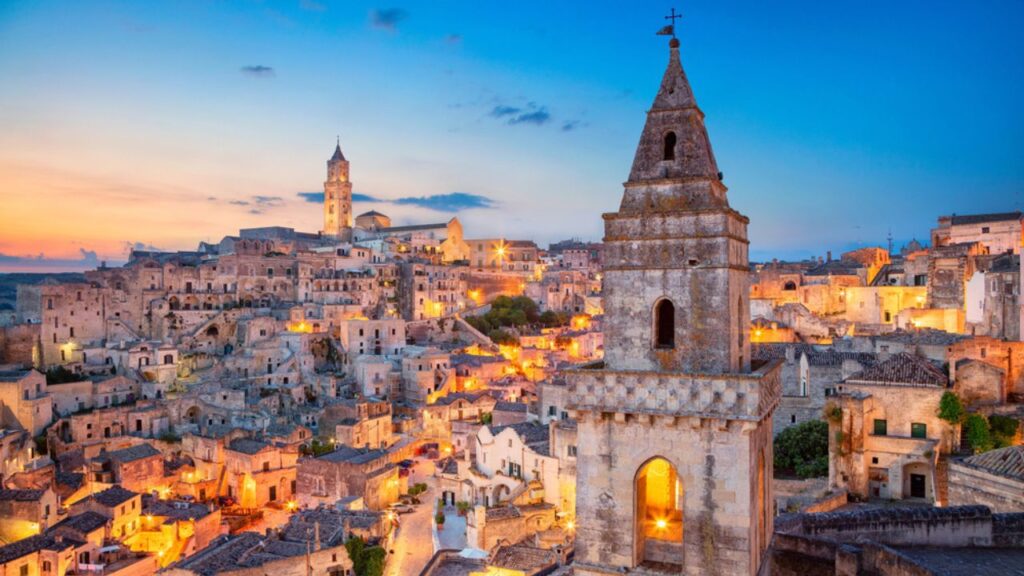 <p>Often called “The City of Stones,” Matera is a special city. Part of it is made from ancient stones, which makes it fascinating. You can walk down its old streets and feel like you are in another age. </p><p>The city is perfect if you’d love to see cave churches and museums, where you can learn about the city’s story, heritage, and culture. For a complete experience, dine at one of Cave’s restaurants and bars and never miss out on foods like pasta con peperoni cruschi, fave e cicoria, Ferricelli, Gelato, Cavatelli, and Orecchiette Pastas.</p>