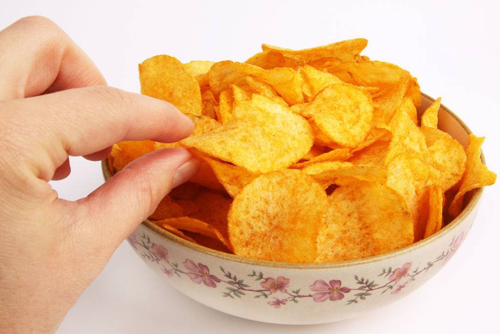<p>If you're somebody that likes to snack while on the road, you may want to consider holding back on the chips. While chips are generally not very good for you, they can also lead to discomfort. </p> <p>When you eat a lot of chips, pretzels, or other salty snacks, your body actually retains more water, leading you to feel bloated. This occurs because your body is attempting to maintain its balance of electrolytes being affected by the chips. </p>