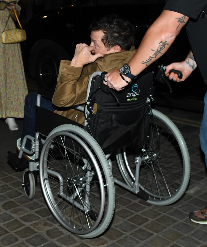 michael j fox flashes peace sign from wheelchair amid devastating parkinson's battle