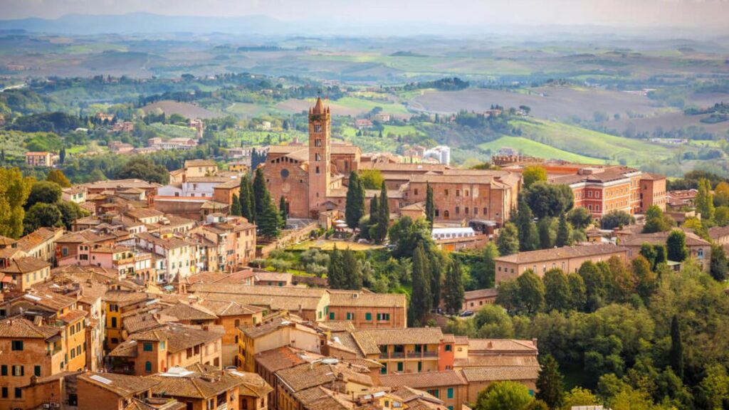 <p>Not far from Florence, you can find the beautiful city of Siena. Often called the “small Florence,” it matches Florence’s beauty despite its smaller size.</p><p>The city is famous for its Palio, Siena’s medieval fair. If you don’t know where to start, you can begin in Piazza del Campo — a huge and stunning medieval square where many tourists take their photos. </p><p>If you are a horse enthusiast, you can witness the Palio — a horse race that happens twice a year at Piazza del Campo.</p>