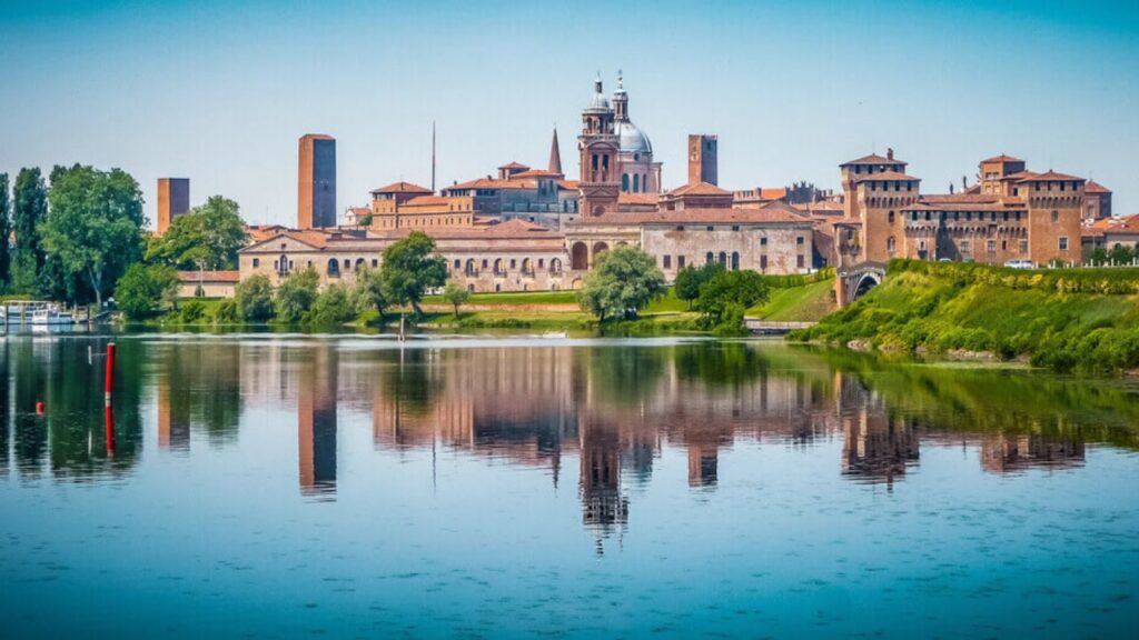 <p>Mantua is another lovely Italian city with stunning churches and opulent palaces. Its historic center is recognized as a UNESCO World Heritage Site. </p><p>Here, you can stroll through cobbled lanes, arcaded streets, and stunning squares. You can visit Ducal Palace, a mini city within a city. Walk through its stunning rooms with ornate ceilings, arched passageways, and lovely tapestries. </p><p>You should also not miss the fresco painted by Lorenzo Costa, a stunning blue zodiac painting. Outside the palace, you can admire the inner courtyards, formal gardens, and orange trees (and feel part of a royal family). </p>