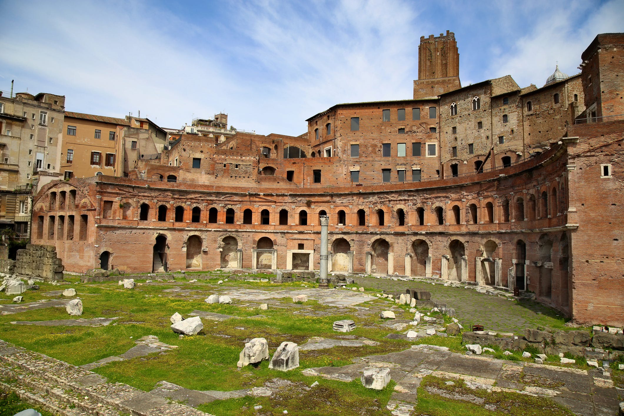 <p><a href="https://www.mercatiditraiano.it/">Trajan's Market</a>, widely considered to be the world's first covered shopping mall, is one of my favorite ancient Roman sites in the city because of its history and well-preserved state.</p><p>It sits squarely along the Via dei Fori Imperiali, a long road stretching from the Colosseum to Piazza Venezia.</p><p><a href="https://www.atlasobscura.com/places/mercatus-traiani-trajans-market">Built by Emperor Trajan</a> around 105 CE, the multi-level structure once housed a library, offices, and shops.</p><p>The remains of wall frescoes and geometric floor mosaics can still be seen in the ground-floor stalls. At the top of the structure is, in my opinion, one of the most beautiful panoramic views of Rome.</p>