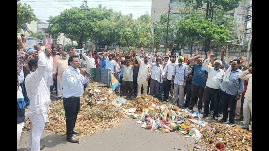 mohali: protesting sanitation workers dump waste outside mc office