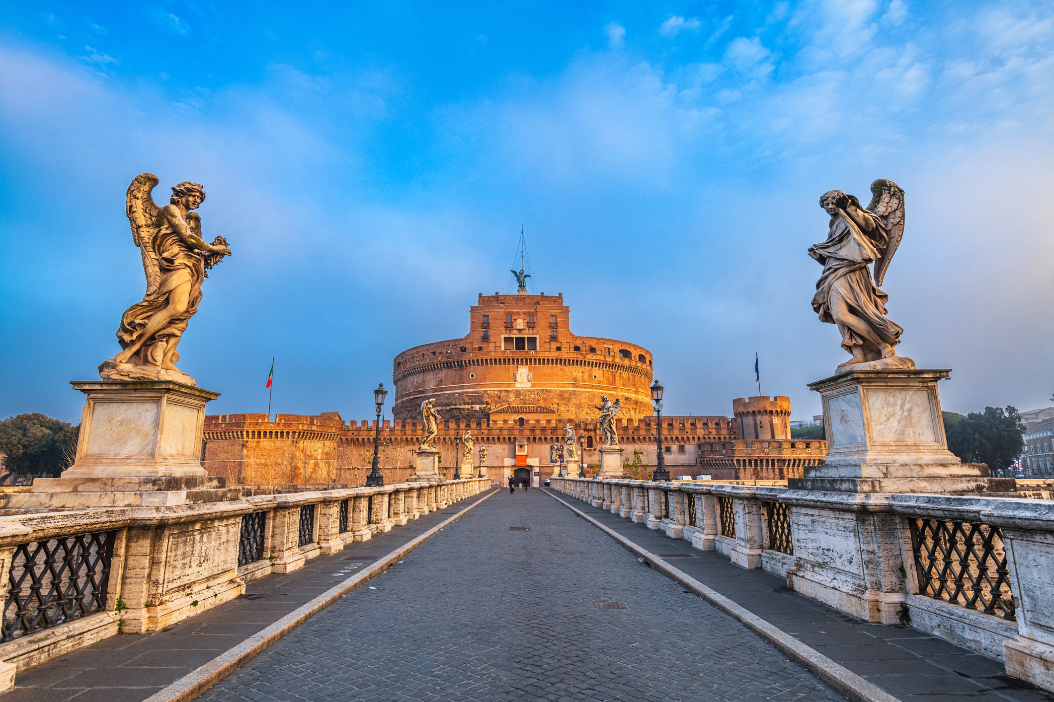 <p>Towering over the Tiber River just outside of the Vatican City is <a href="http://castelsantangelo.beniculturali.it/">Castel Sant' Angelo</a>. The ancient structure was originally built as a mausoleum for the Roman Emperor Hadrian around 139 CE.</p><p>Over the centuries it was used as a fortress, military barracks, and a prison, the remains of which can still be seen inside today.</p><p>I've been visiting the site since I was little, and love the panoramic view of the Tiber River and the dome of Saint Peter's Basilica from its top, especially at sunset. </p><p>I also enjoy the structure's small, open-air café and restaurant overlooking the scenery, which is ideal for those who may need a break from all the sightseeing.</p>
