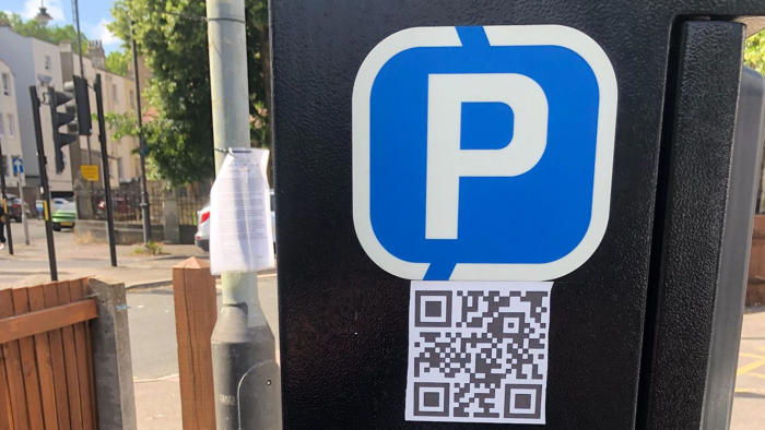 warning after scam qr codes appear in car parks