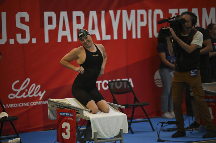 while simone biles competes across town, paralympic star jessica long rolls at swimming trials