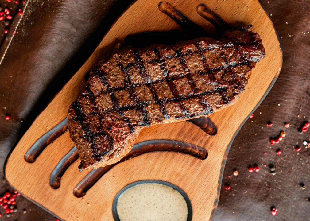 <p>The French have their bistros. The English have their pubs. And the Americans have their steakhouses.</p><p>Going out for a steak has been a pivotal part of American culture for more than a century, but it wasn't always considered a high-class, expensive meal. In New York City in the 1800s, working-class folks would down pints of ale and <a href="https://www.atlasobscura.com/foods/beefsteak-banquet">feast on slices of beefsteak</a> (usually without utensils and atop white or French bread) for celebratory meals. Sometimes, the "beefsteak banquet," as it was known, would be put on as a political fundraiser. </p><p>Soon, fine-dining establishments opened up to take those steak dinners up a notch, like Delmonico's in 1837, Old Homestead Steakhouse in 1868, and Carl Luger's Café, Billiards and Bowling Alley (now Peter Luger) in 1887. One thing has remained the same though: Dining at a steakhouse is still synonymous with celebration. It's the kind of meal used to mark milestone moments on the path to the American dream—get a job, buy a house, go out for steak.</p><p>The steakhouse experience has certainly modernized from the days of eating beef with your hands and slugging beers. Ordering a steak involves choosing the best cuts, like rib-eye, filet mignon, and New York strip. Then there are the starters—a shrimp cocktail, oysters Rockefeller, or a classic house salad with your choice of dressing. And of course, you can't forget all of the accouterments—the potato (baked, mashed, or au gratin?), the vegetable (creamed spinach, sautéed asparagus, or roasted broccoli?), and a slice of classic New York cheesecake to finish it off.</p><p>More than a century after the steak dinner got upgraded in New York City, chain steakhouses started bringing this central part of the American culinary tradition cross-country in the 1980s and '90s with spots like Texas Roadhouse, LongHorn Steakhouse, Outback Steakhouse, and The Capital Grille. Today, with so many steakhouses to choose from, it takes high-quality service, top-of-the-line cooking, and of course, the best cuts of beef to stand out from the rest.</p><p>How will you choose where to live out this iconic American meal? To help, <a href="https://www.stacker.com/texas/killeen">Stacker</a> compiled a list of the highest-rated steakhouses in Killeen, according to diners' reviews on <a href="https://www.yelp.com/">Yelp</a> as of January 2024. Only restaurants with at least five reviews were considered. </p><p><em>Note: The photos in this article are stock images and do not necessarily depict the specific restaurants listed or the dishes they serve.</em></p><p><strong>You may also like:</strong> <a href="https://stacker.com/texas/killeen/where-people-killeen-are-looking-buy-homes">Where people in Killeen are looking to buy homes</a></p>