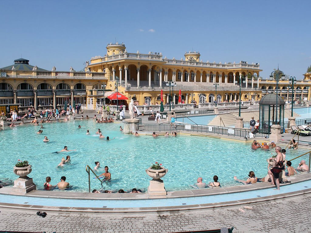<p>Step into tranquility at Budapest’s iconic Szechenyi Bath complex, the crown jewel of the city’s public baths. Situated right in the heart of bustling Budapest, this beautiful yellow building invites both locals and tourists to indulge in its numerous offerings. For just $16, you can immerse yourself in the large baths for an entire day, choosing from a variety of outdoor and indoor options with different temperatures to suit your mood. To truly embrace the local experience, set your alarm for an early morning dip and start your day off on a blissful note, long before the crowds of tourists arrive to make a splash.</p> <p>The post <a href="https://travelreveal.com/destination-guides/hot-springs-near-me/">Hot Springs Retreats for the Ultimate Relaxation Experience</a> appeared first on <a href="https://travelreveal.com">Travel Reveal</a>.</p>