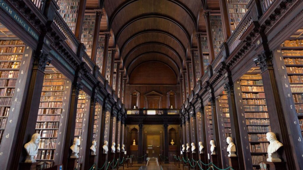 <p>The Trinity College Library in Dublin is the biggest library in Ireland. It is divided into <a href="https://www.tcd.ie/library/new-students/">five main buildings</a>: the Old Library which houses special collections and early printed books, the Hamilton Library, and the Lecky, Ussher and Berkeley Libraries.</p><p>The Trinity College Library holds the Kell collection, which is one of the most valuable manuscripts in Ireland. Upon entry, visitors are welcomed by an artistic masterpiece — the Long Room. With its wooden floors and bookcases, concave ceilings, and iron claddings, it is like being taken back to the 18th century.</p>